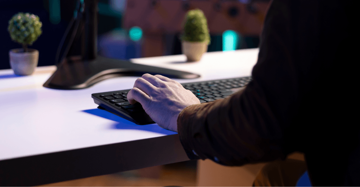 person typing on keyboard